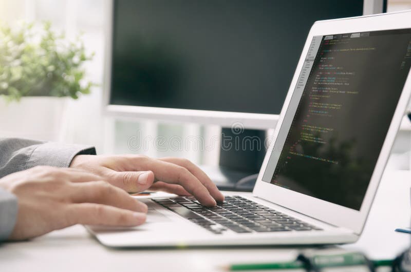 Programmer working busy software developing in company office stock images
