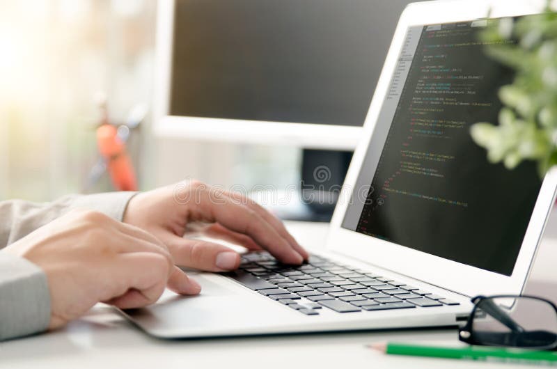 Programmer working busy software developing in company office stock images