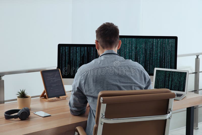 Programmer working at desk in office royalty free stock image