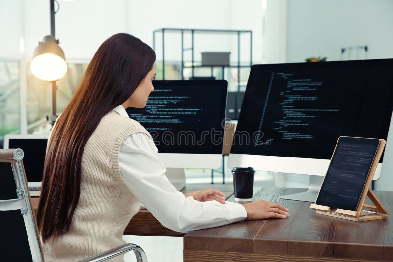 Programmer working at desk in office royalty free stock photography