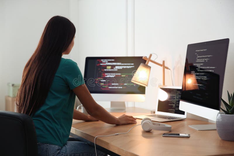 Programmer working at desk in office stock photography