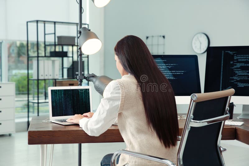 Programmer working at desk in office royalty free stock image