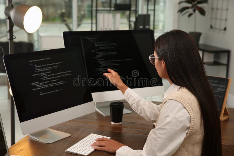 Programmer working at desk in modern office royalty free stock photos