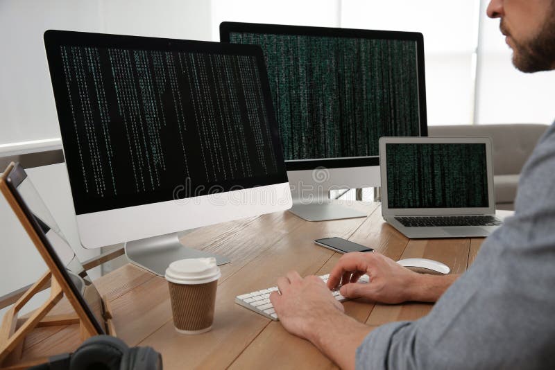 Programmer working at desk in office royalty free stock photography