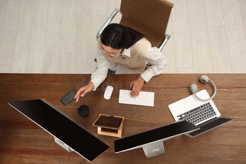Programmer working at desk in office, top view royalty free stock images