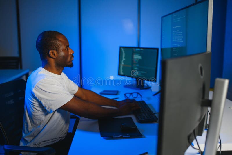 African american IT Programmer Working on Desktop Computer. royalty free stock images