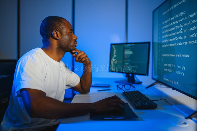 African american IT Programmer Working on Desktop Computer. stock image