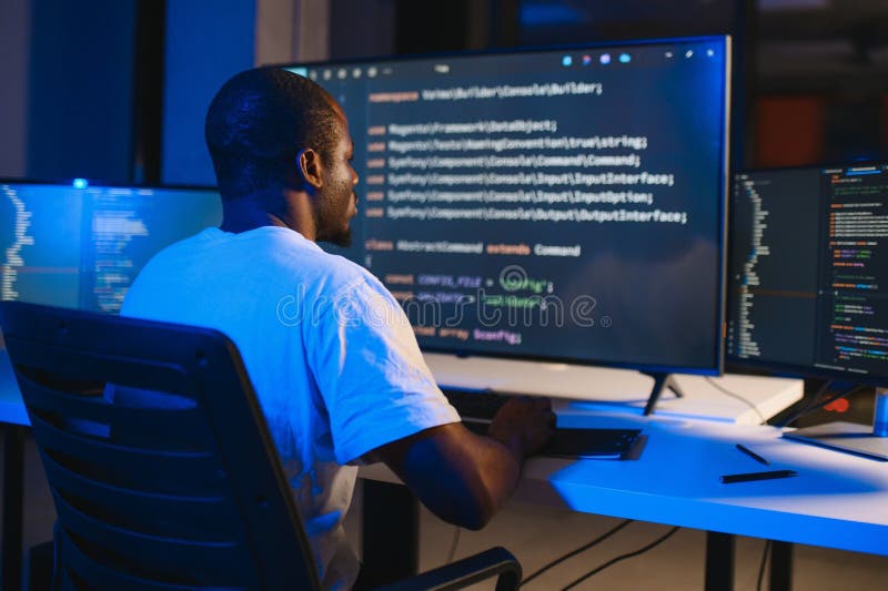 African american IT Programmer Working on Desktop Computer. stock photos