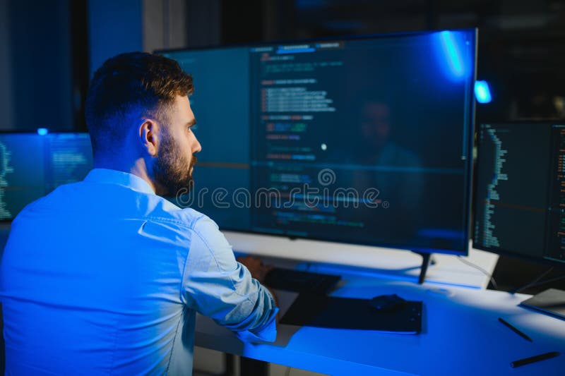IT Programmer Working on Desktop Computer. royalty free stock photos