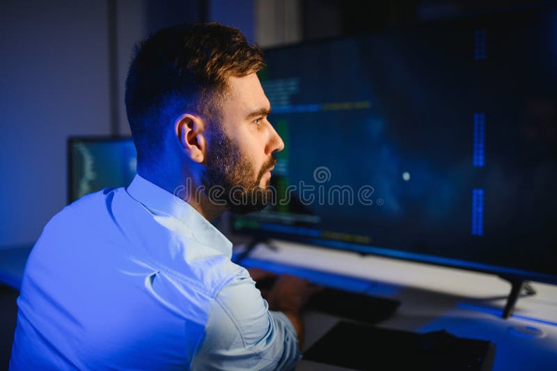 IT Programmer Working on Desktop Computer. royalty free stock photography