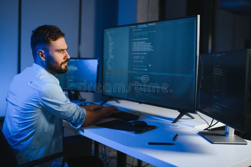 IT Programmer Working on Desktop Computer. stock images