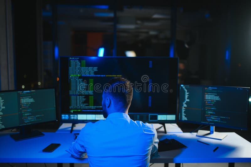 IT Programmer Working on Desktop Computer. stock image