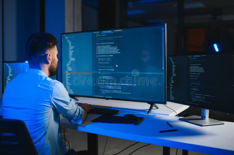 IT Programmer Working on Desktop Computer. stock images