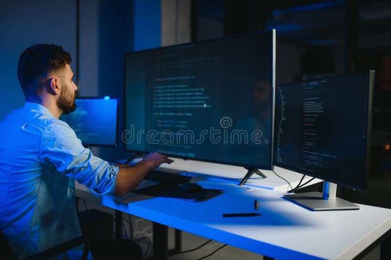 IT Programmer Working on Desktop Computer. stock photos