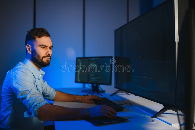 IT Programmer Working on Desktop Computer. stock image