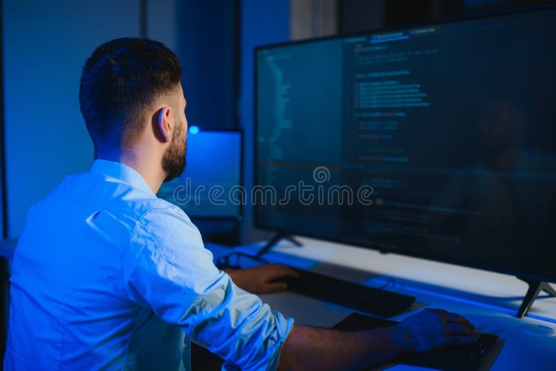 IT Programmer Working on Desktop Computer. stock image