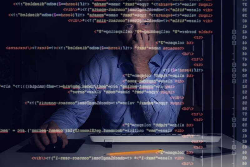 programmer working with programming code on computer screen royalty free stock photos