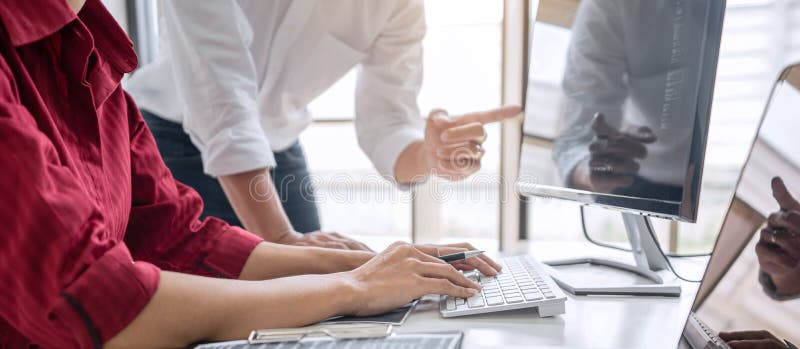 Programmers cooperating at Developing programming and website working in a software develop company office, writing codes and typing data code, Programming with HTML, PHP and javascript. Developing programmer stock images, royalty-free photos and pictures