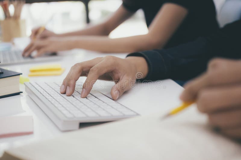 Programmers and developer teams are coding and developing software stock image