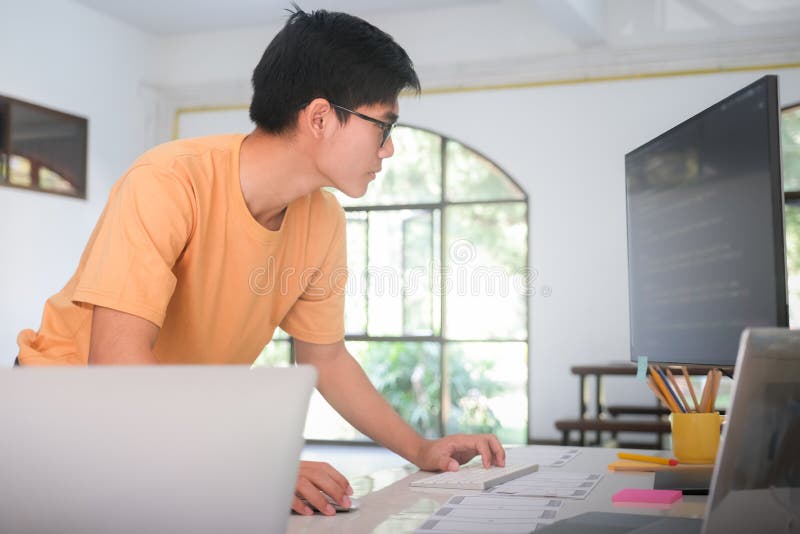 Programmers and developer teams are coding and developing software. stock photos