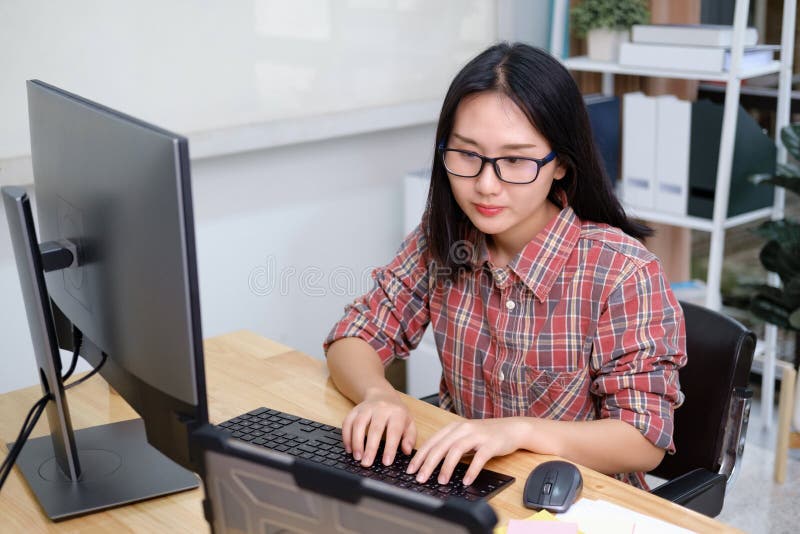 Programmers and developer teams are coding and developing software stock photos