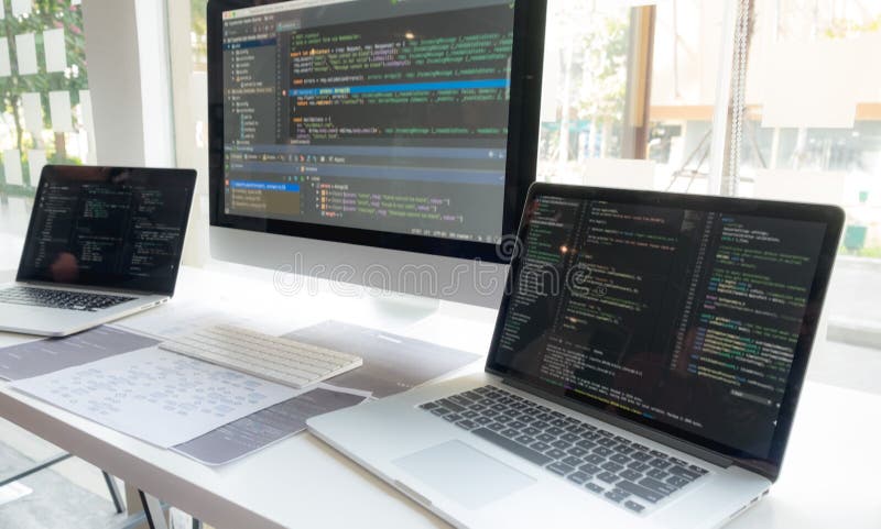 Programmers work on the development of coding and coding technology on white desks and website design, software, data processing royalty free stock photography