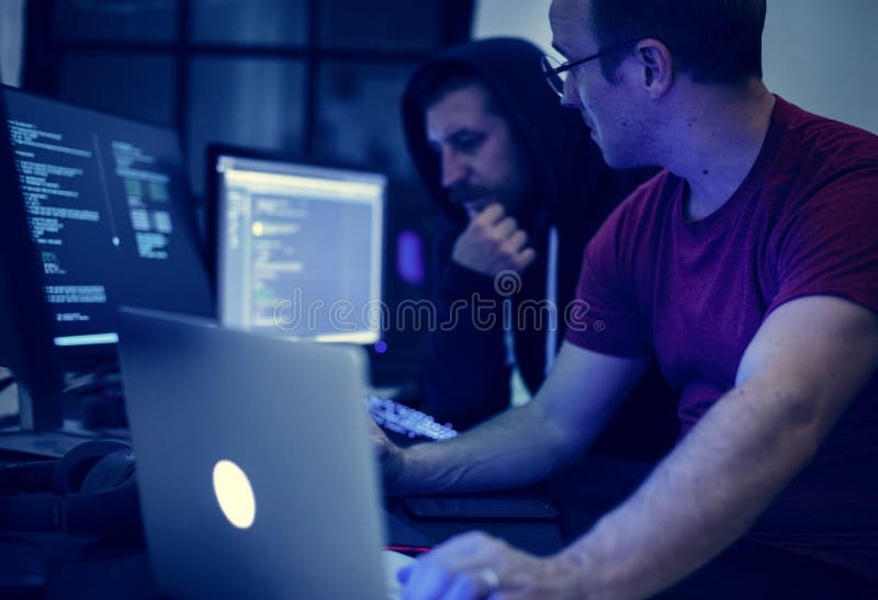 Programmers working on computer program. Programmers stock images, royalty-free photos and pictures