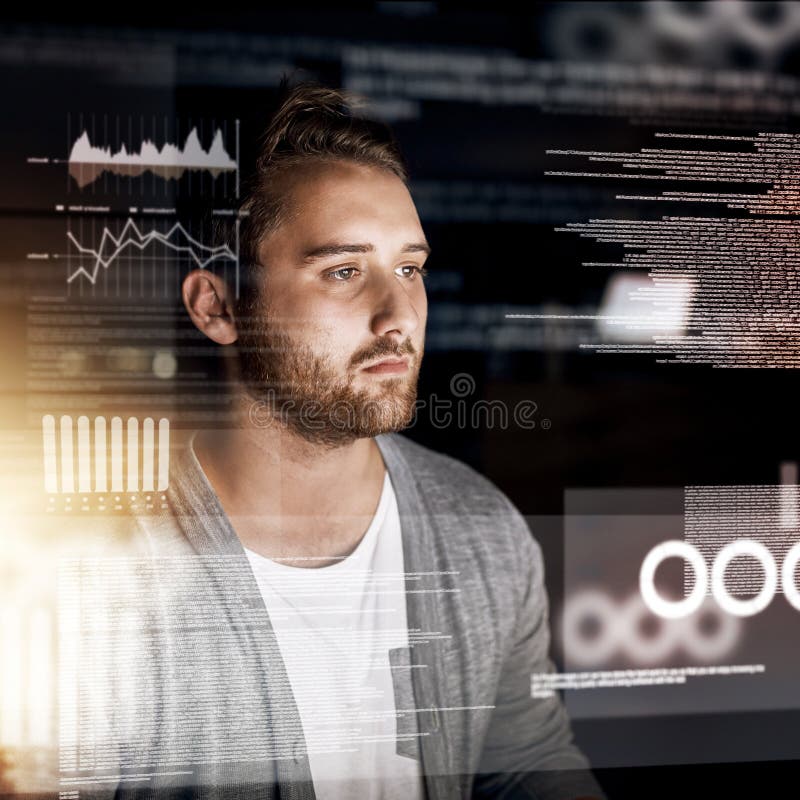 Programming the night away. a young computer programmer working on source code. stock images