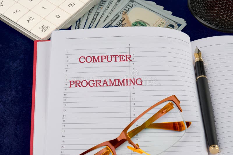 Programming online network metaverse digital world technology. COMPUTER PROGRAMMING written in a business notebook, a royalty free stock photo