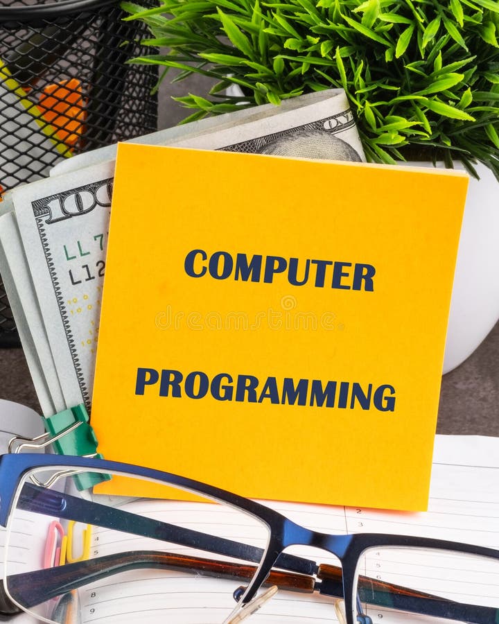 Programming online network metaverse digital world technology. COMPUTER PROGRAMMING written on a yellow sticker, front royalty free stock image