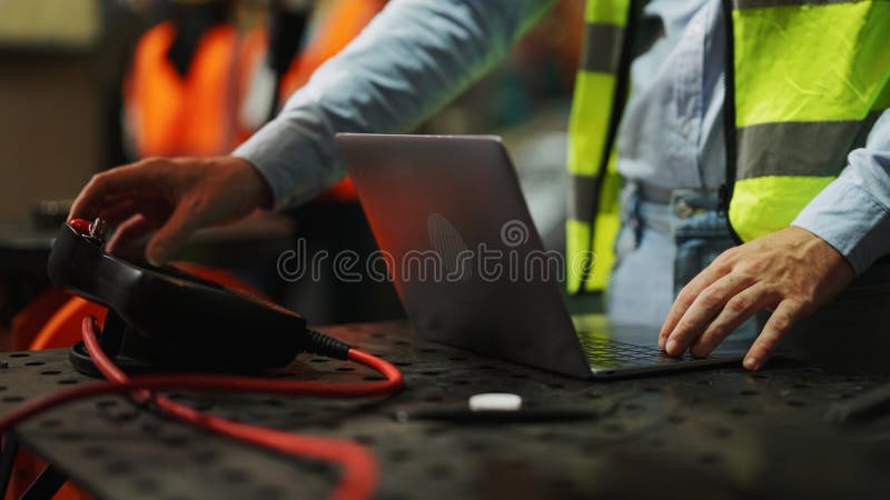 Programming robot controller, Programming robotic arms in factory industrial royalty free stock images
