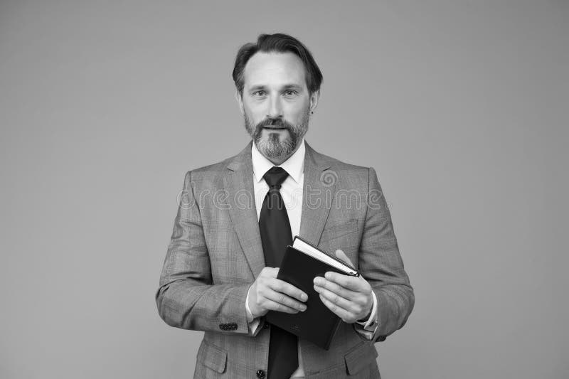 A progressive approach. planning and success. reading a book. businessman find interesting information in book. get royalty free stock images