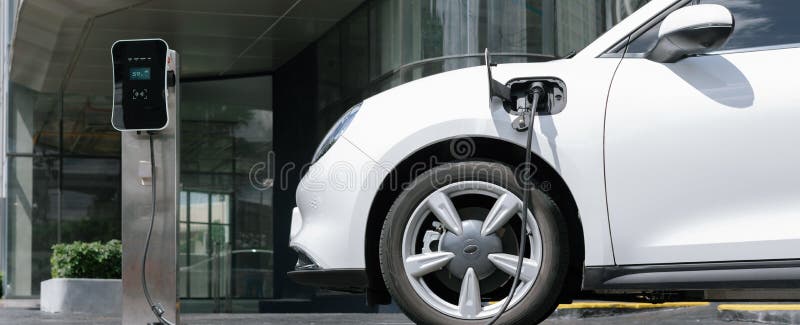 progressive-ev-car-at-city-residential-with-electric-charging-station