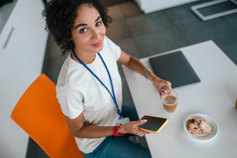 Project assistant with a badge having a lunch break stock photos