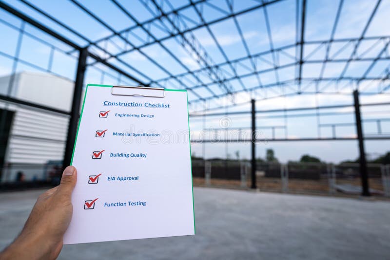 A project engineer is using construction safety checklist. stock photo