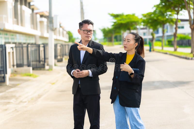The project manager consults his assistant to check the progress o stock photos