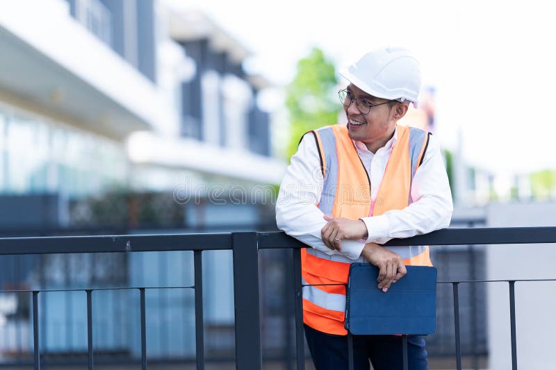 The project owner is inspecting the construction of a new house, and the engineer or architect or quality control contractor stock photos