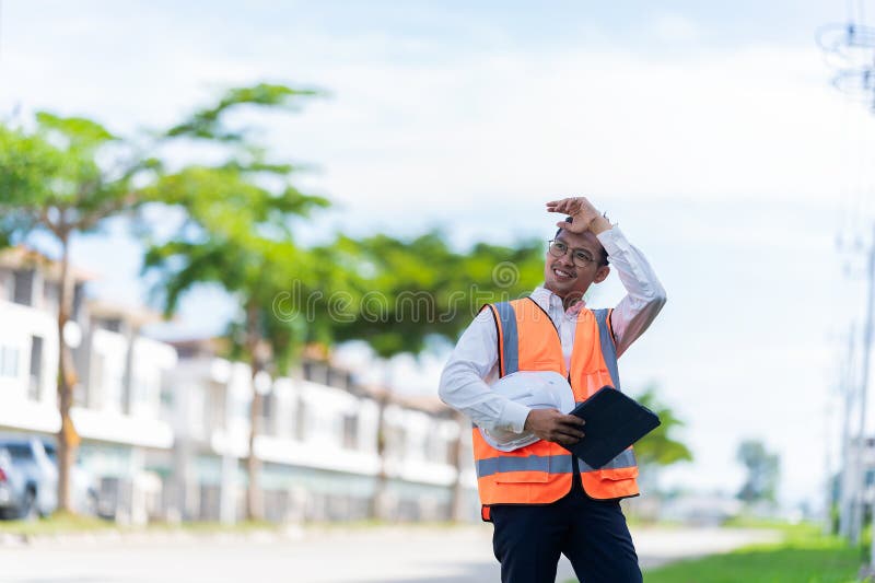 The project owner is inspecting the construction of a new house, and the engineer or architect or quality control contractor royalty free stock photography