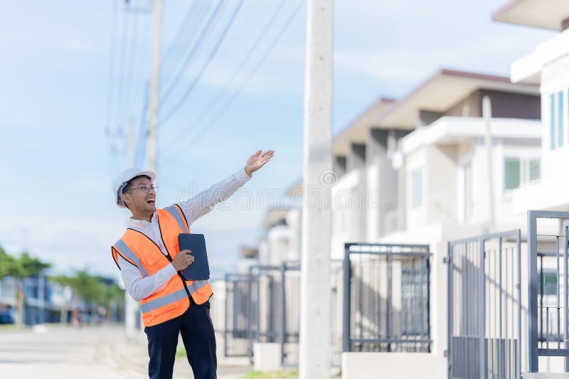 The project owner is inspecting the construction of a new house, and the engineer or architect or quality control contractor royalty free stock images