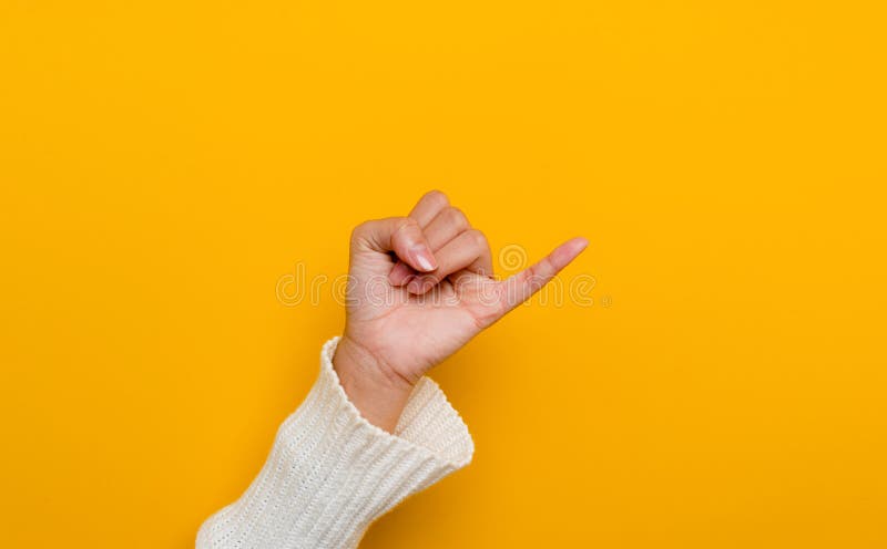 The promise of a white Asian woman's hand little finger split on yellow background gestures of commitment and reconciliationThe promise of a white Asian woman's hand little finger split on yellow background gestures of commitment and reconciliation. The promise of a white Asian woman's hand little finger split on yellow background gestures of commitment and reconciliationThe promise of a white Asian woman's hand little finger split on yellow background gestures of commitment and reconciliation