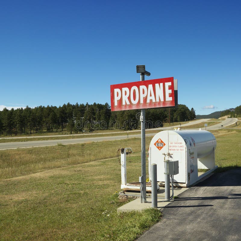 Propane tank on side of road.