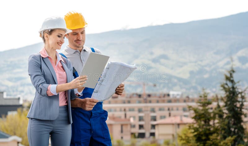 Property developer and construction worker creating project together stock photos