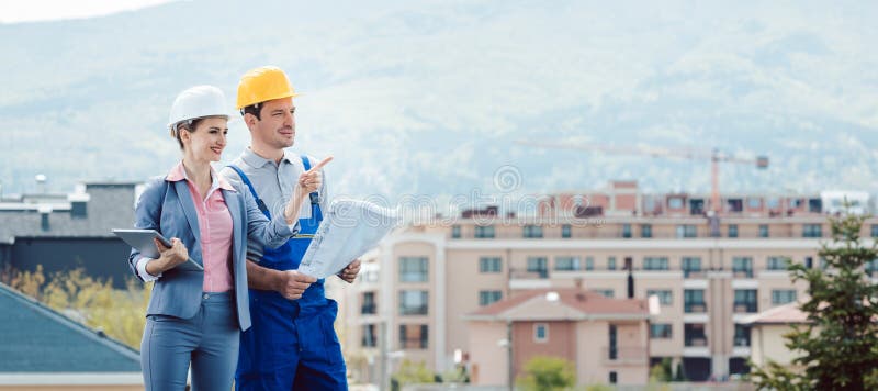 Property developer and construction worker creating project together royalty free stock photos