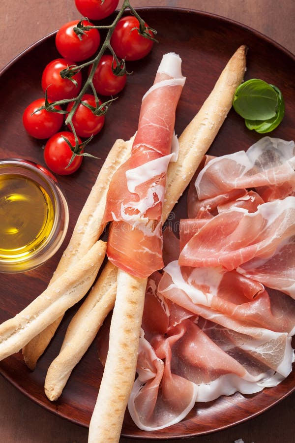 Prosciutto ham and grissini bread sticks. italian antipasto stock image Prosciutto ham and grissini bread sticks. italian antipasto stock image