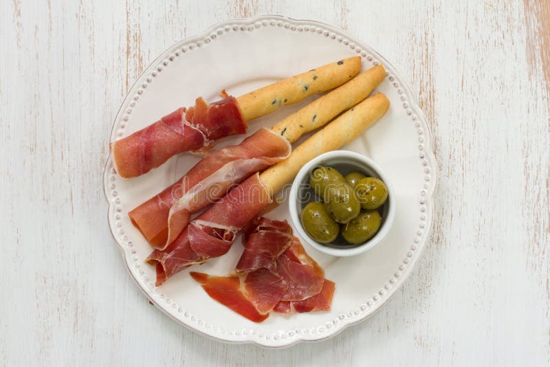 Prosciutto with olives stock image. Image of prosciutto 51359943