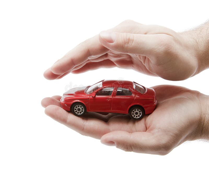 Car protection. Red toy car and hands. Clipping path included. Car protection. Red toy car and hands. Clipping path included.