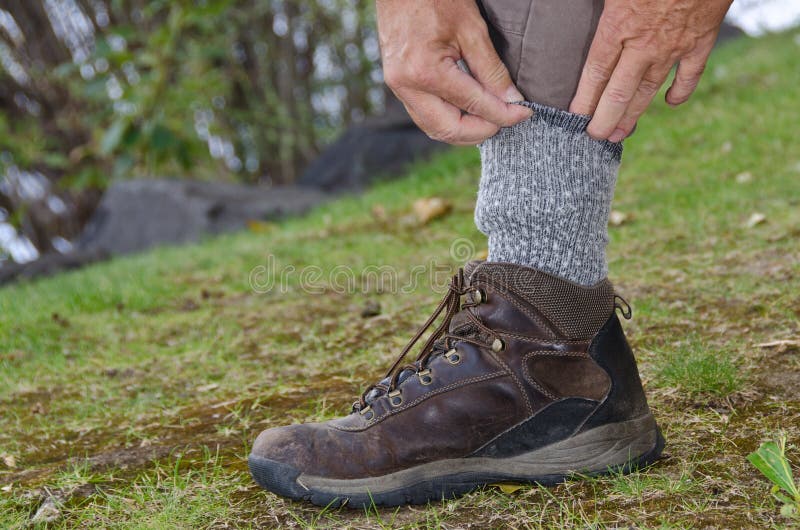 Protecting Against Ticks by Tucking Pants into Socks Stock Photo