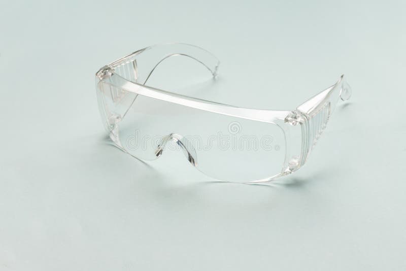 [Protection Medical] Protective Glasses Isolated on a Light Blue