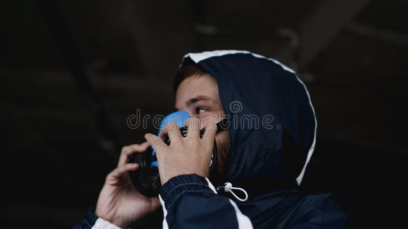 Protection respirator half mask for toxic gas. The man prepare to wear protection air pollution. A man puts on a mask. Selective focus royalty free stock photo Protection respirator half mask for toxic gas. The man prepare to wear protection air pollution. A man puts on a mask. Selective focus royalty free stock photo