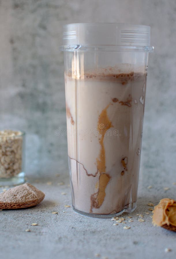 Protein Shake in a Blender Cup on a White Background Stock Image